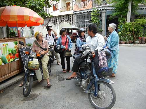 Maryknollers gathering on a street corner